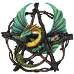 Decorative item with dragons and a star-like design on a black background