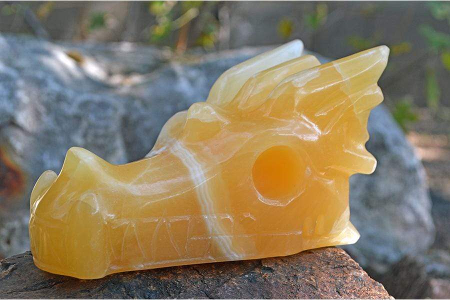 Crystal Wholesale ii - 29.31 oz Pale Orange Calcite (with White Inclusions) Crystal Dragon Skull Carving - Medium