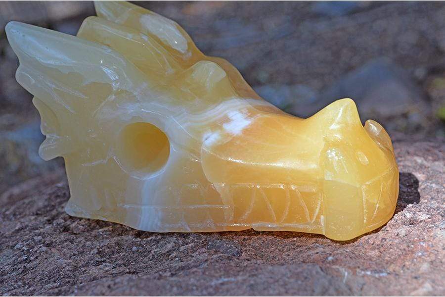 Crystal Wholesale Pale Orange Calcite (with White Inclusions) Crystal Dragon Skull Carving - Medium