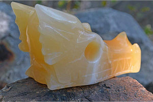 Crystal Wholesale Pale Orange Calcite (with White Inclusions) Crystal Dragon Skull Carving - Medium